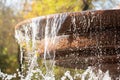 fountain element with flowing streams of water and with fine splashes, concept