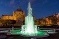 A fountain with emerald lighted water in King Tomislav park and square, Zagreb, Croatia Royalty Free Stock Photo