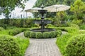 Fountain in english garden design. Royalty Free Stock Photo