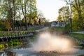 Fountain in the evening sunlight in Kuld?ga city park, Latvia Royalty Free Stock Photo