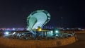 A fountain featuring an oyster with a gigantic pearl inside night timelapse hyperlapse with the Doha skyline behind it Royalty Free Stock Photo