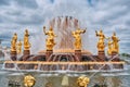 Fountain Friendship of Peoples at VDNH, sky with clouds and golden statues. Moscow, Russia 05 24 2019 Royalty Free Stock Photo