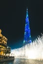 Fountain in front of the blue illuminated Burj Khalifa Dubai - UAE Royalty Free Stock Photo