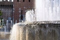 Fountain In front of the entrance to castle known as Castello Sforzesco, Milan, Lombardy, Italy. Closeup Royalty Free Stock Photo