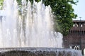 Fountain In front of the entrance to castle known as Castello Sforzesco, Milan, Lombardy, Italy. Closeup Royalty Free Stock Photo