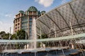 A fountain in front of  Festive Hotel, a five-star hotel in the art-deco architecture style at Resort World Sentosa, Singapore Royalty Free Stock Photo