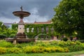 Fountain in front the historic university building Palaestra et Odeum in Lund Sweden on a summer day