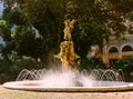 Fountain at Gabriel Miro plaza in Spanish city of Alicante at Costa Blanca surrounded by green palm trees historical landmarks