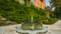 A fountain in the garden in Poland - north of the country - a castle in the middle of the forest - overlooking the trees and beaut