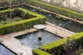 Fountain in green generalife garden park in alhambra