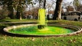 Fountain with green water in Paris