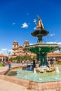 Fountain of Incan emperor Pachacuti and church of the Society of Jesus at Plaza De Armas, Cuzco, Peru Royalty Free Stock Photo