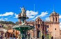 Fountain of Incan emperor Pachacuti and Cuzco cathedral at Plaza De Armas, Cuzco, Peru