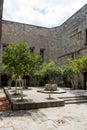 fountain inside old stone house surrounded by greenery, central courtyard, latin america Royalty Free Stock Photo