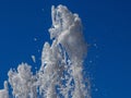 Fountain, a jet of water against the blue sky Royalty Free Stock Photo