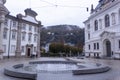 Fountain at Kajetanerplatz. Salzburg Regional Court on the right, Kajetanerkirche on the left