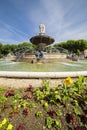 Fountain at La Rotonde with flowers in Aix-en-Provence Royalty Free Stock Photo