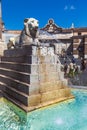 Rome, Italy. June 29, 2022: Fountain of the lions at Piazza del Popolo in Rome. Lion with water jet and tourists