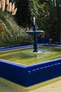 Fountain with a little pool at sunset in Majorelle garden, Marrakech, Morocco