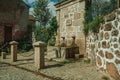 Fountain made of stone with small water spout