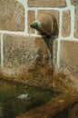 Fountain made of stone with a small water spout