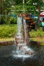 Fountain made of stones in the summer park Royalty Free Stock Photo