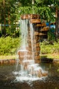 Fountain made of stones in the summer park