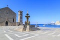 Fountain in Madraki port with Evangelismos church and clock tower in Rhodes Royalty Free Stock Photo