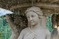 Fountain marble Statue of a woman and a fountain, water pours. drops of water and face