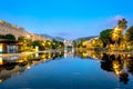 Fountain with mirrored reflection of night town at Place Massena in Nice. France Royalty Free Stock Photo