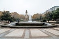 Fountain and monument in urban park a rainy day Royalty Free Stock Photo