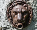 Fountain with muzzle of an iron lion Royalty Free Stock Photo