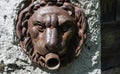 Fountain with muzzle of an iron lion Royalty Free Stock Photo