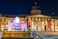 Fountain and the National Gallery on Trafalgar Square in London, England Royalty Free Stock Photo