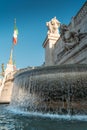 Fountain at National Monument to Victor Emmanuel II in Rome, Italy with Italian flag Royalty Free Stock Photo