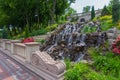 The fountain is in a natural style, made in the form of a source draining down the chaotically scattered stones Royalty Free Stock Photo