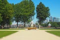 A fountain near the Old Royal Naval College in Greenwich, London with the Canary Wharf skyscrapers in the background in summer. Royalty Free Stock Photo