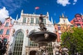 Fountain of the Neptune with face mask in old town of Gdansk, Poland