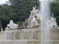 Fountain next to a statue in Schonbrunner Schloss Park in Vienna, Austria