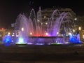 Fountain at night lighted with various colours