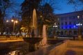 Fountain in the night park. Autumn night landscape in the park trees Royalty Free Stock Photo