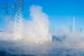 Fountain in a nonfreezing reservoir Royalty Free Stock Photo