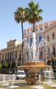 Fountain with palm trees and buildings in Jerez of Frontera in Spain