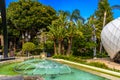 Fountain with palms in park of La Condamine, Monte-Carlo, Monaco, Cote d `Azur, French Riviera