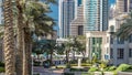 Fountain and palms timelapse at the Marina walk, During day time. Dubai, UAE