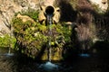 Fountain in a park with water flowing from an old amphora, Cagliari, Sardinia Royalty Free Stock Photo