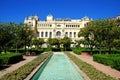 Fountain in the Pedro Luis Alonso gardens with the city hall to the rear, Malaga, Spain. Royalty Free Stock Photo