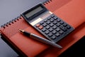 A fountain pen, calculator and cheque book or note book Royalty Free Stock Photo