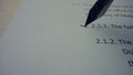 Fountain pen drawing line on business paper. Person crossing text in contract