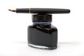 Fountain pen on the ink bottle Royalty Free Stock Photo